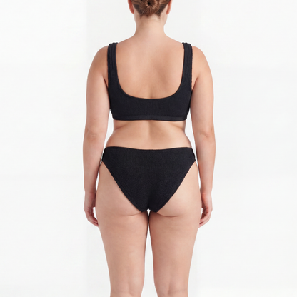 Back view of the Amalfi bikini with low waisted bottoms in midnight black