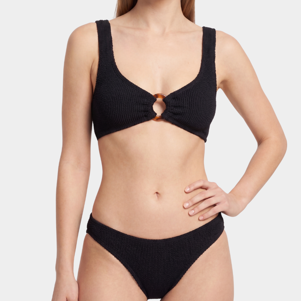 Front view of the Portofino bikini with tortoise shell hoop and low waisted bottoms in midnight black