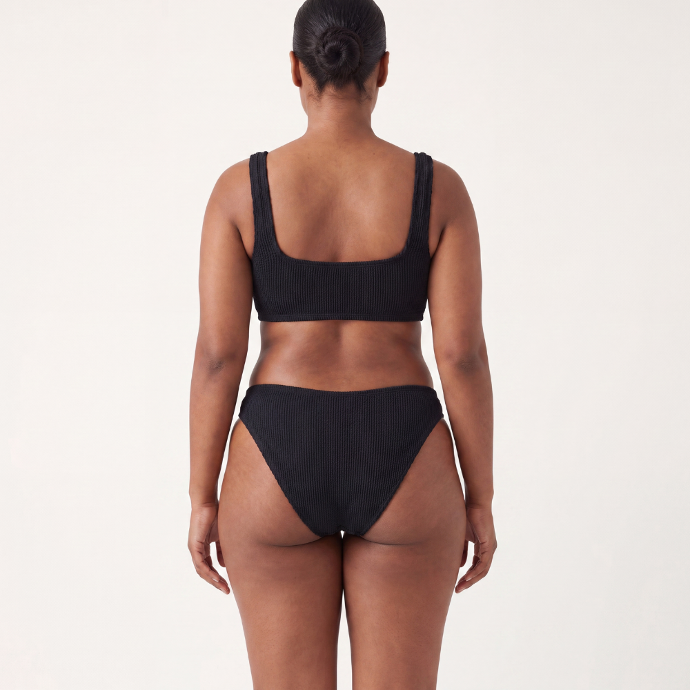 Back view of the Amalfi bikini with low waisted bottoms in midnight black