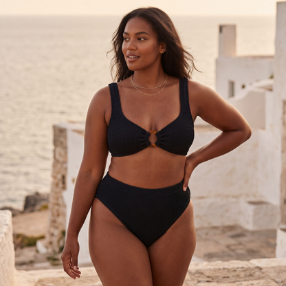 Plus size model wearing the Portofino bikini with high waisted bottoms by the Mediterranean
